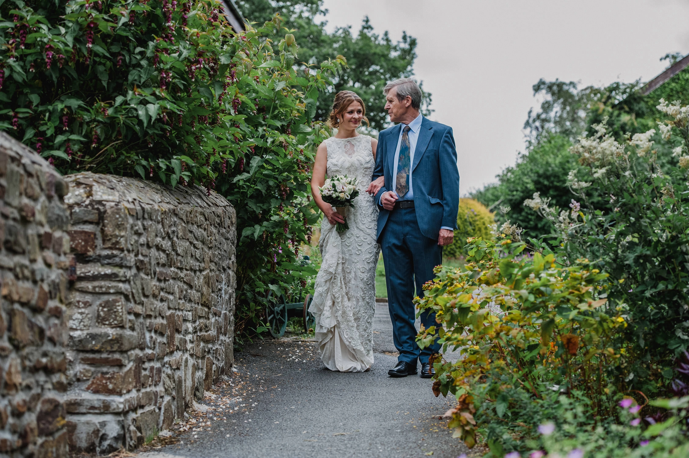 North devon wedding photographer, countryways cottages wedding photography north devon, bride and father walking to ceremony at country ways cottages in north devon